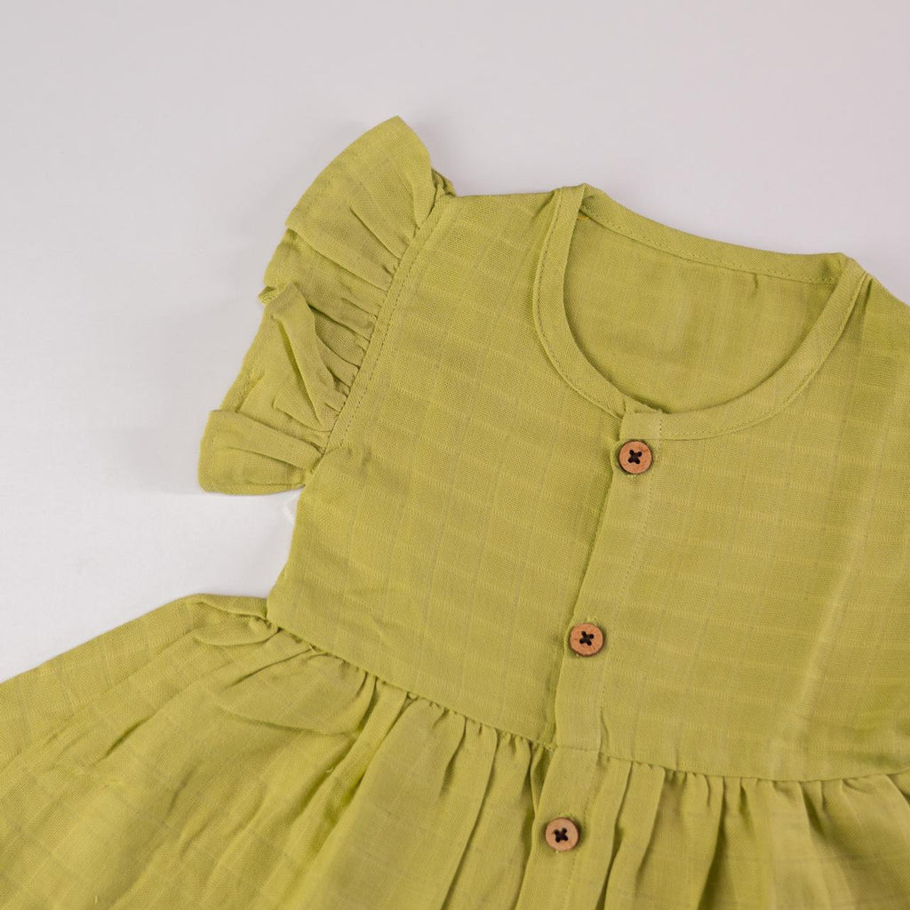 Green Muslin Baby Frock with Wooden Buttons – Soft & Stylish
