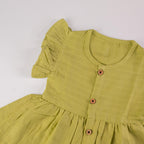 Green Muslin Baby Frock with Wooden Buttons – Soft & Stylish