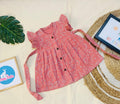 Pink Dino Muslin Baby Frock with Wooden Buttons – Soft & Stylish