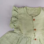 Pista Green Muslin Baby Frock with Wooden Buttons – Soft & Stylish - Image 3